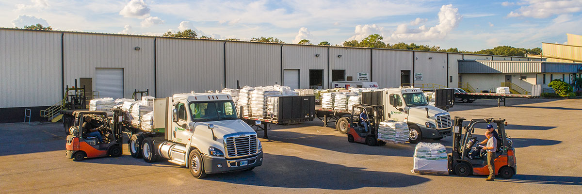 Harrell's Warehouse with guys on forklift loading a truck